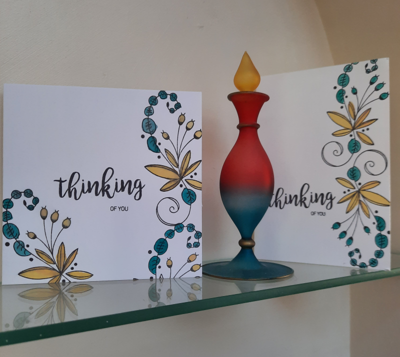 Image of two Clean and Simple type  cards with a flower design and sentiment Thinking of You